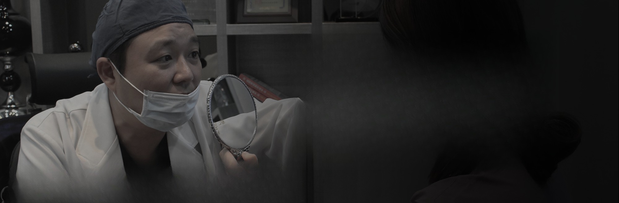 Hyundai Aesthetic Surgery - specialist consulting with a mirror